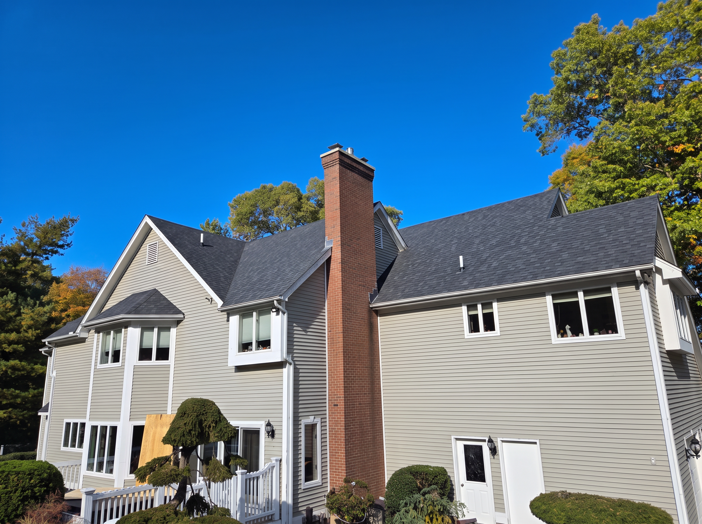 Premium architectural shingle roof after replacement