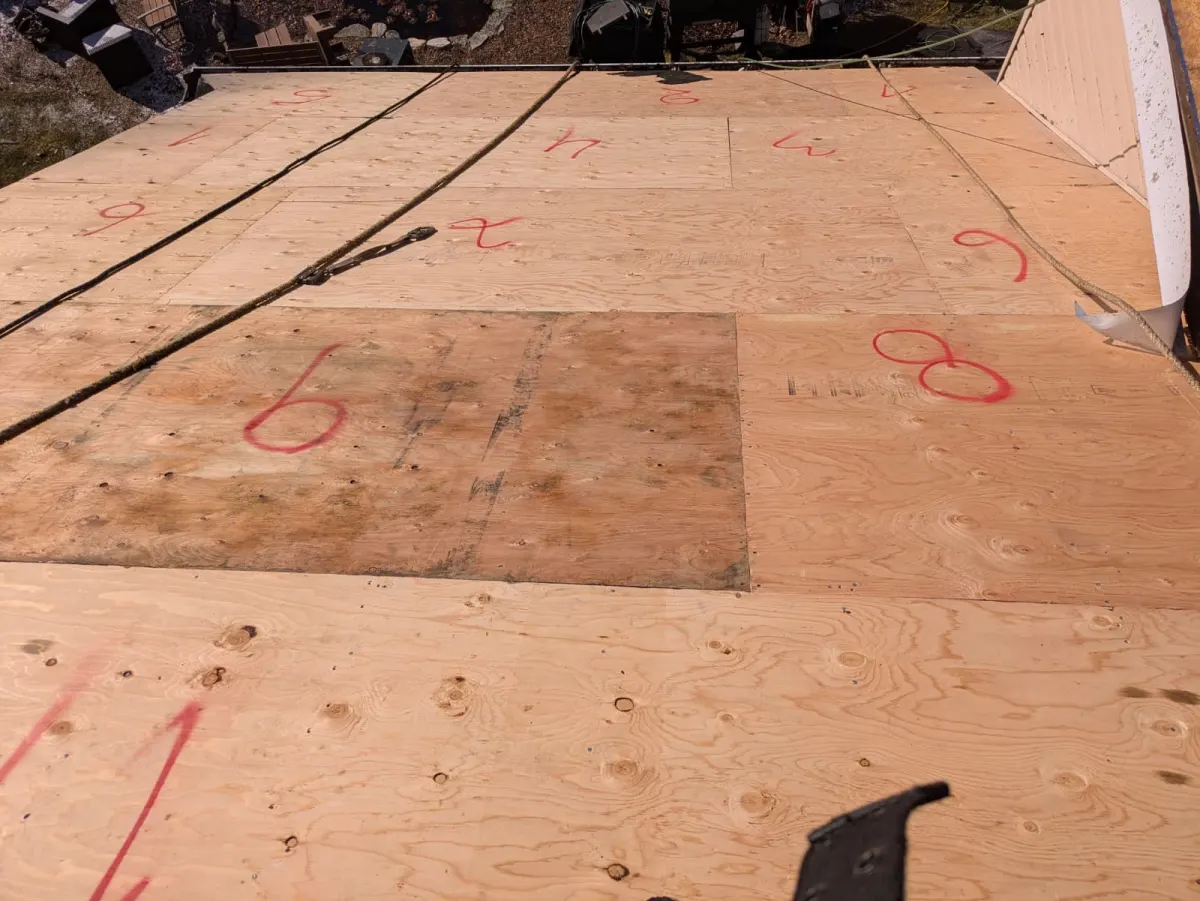 Numbered plywood roof decking during installation